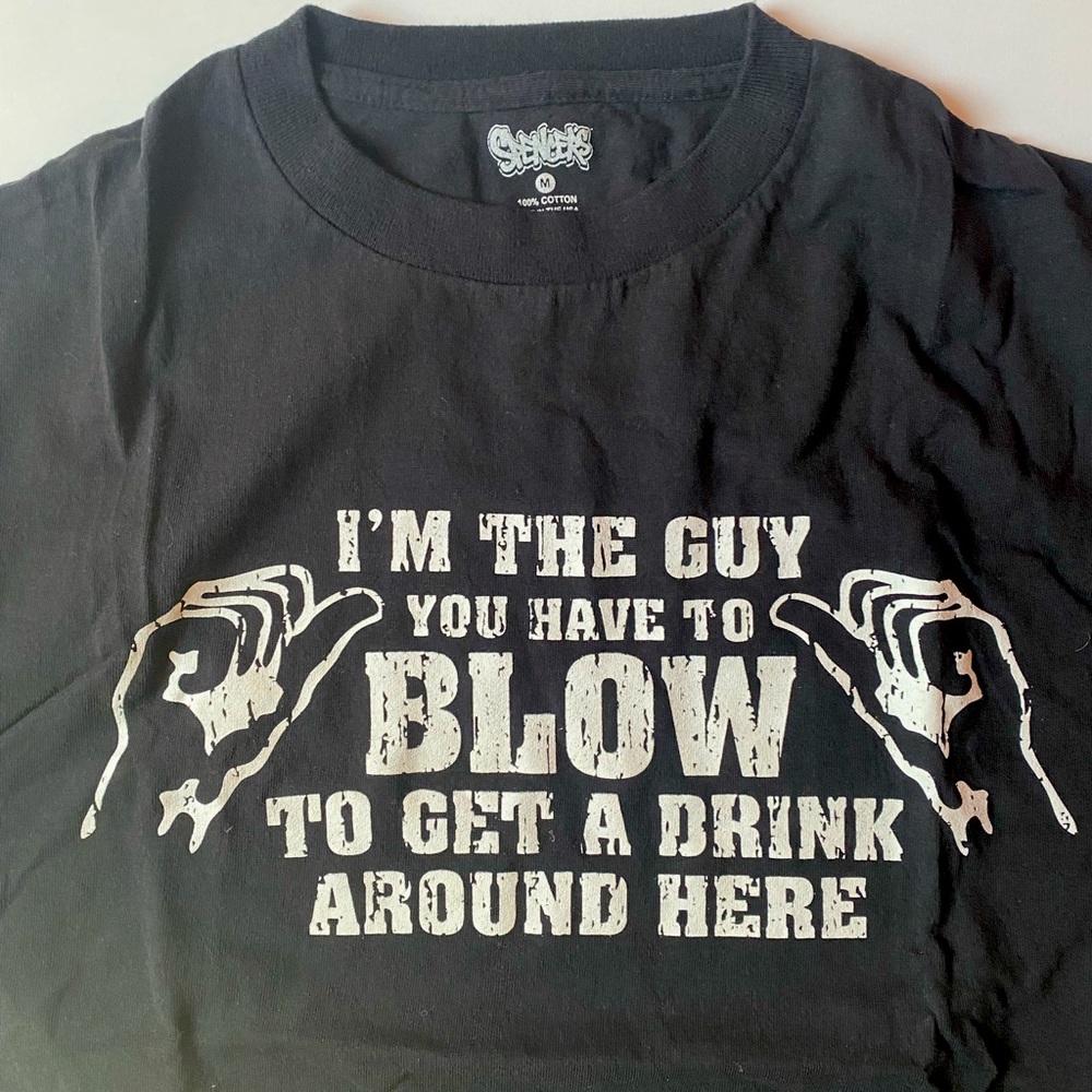 Off-color pun graphic tee. “U’m the guy you have to xxxx to get a drink….”
